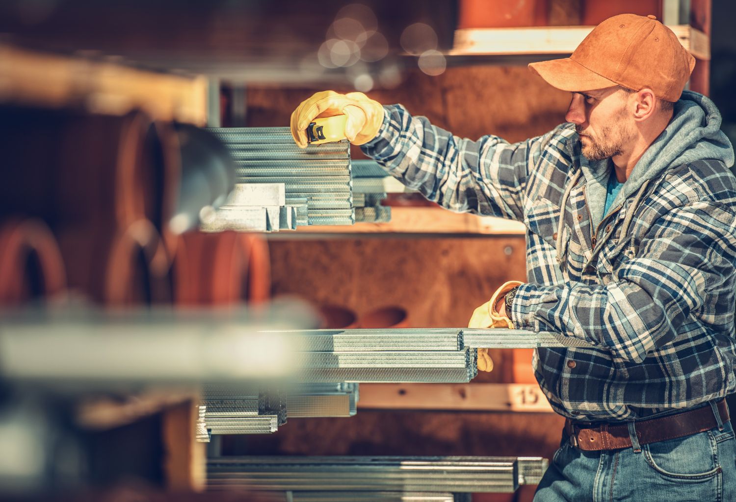 Choosing right building materials. Caucasian contractor looking for the sanitary system pipes. Construction Industry.